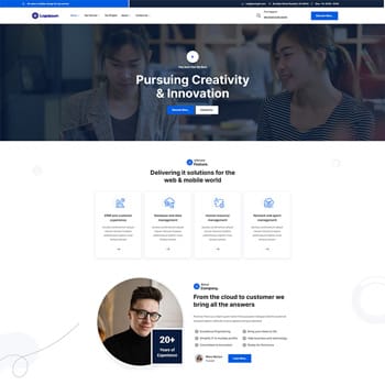 Website homepage of a digital solutions company showcasing two women collaborating, with a focus on creativity and innovation in web and mobile development. Features include service highlights and a professional profile with 20+ years of experience.