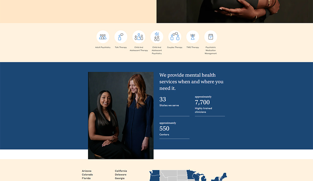 Two mental health professionals posing together, representing a mental health service that offers adult psychiatry, talk therapy, child and adolescent therapy, couples therapy, TMS therapy, and psychiatric medication management across 33 states with around 7,700 trained clinicians and approximately 550 centers.