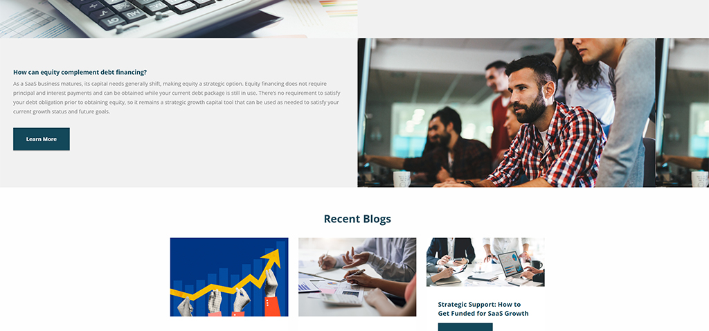 Image of a modern office setting with a group of diverse professionals engaged in a discussion around a table, showcasing collaborative work and strategic planning for business growth. The background features a computer keyboard and financial graphs, emphasizing themes of equity and debt financing in a SaaS business context.