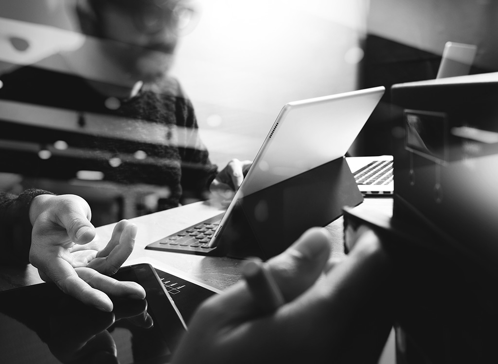 Person working on digital devices